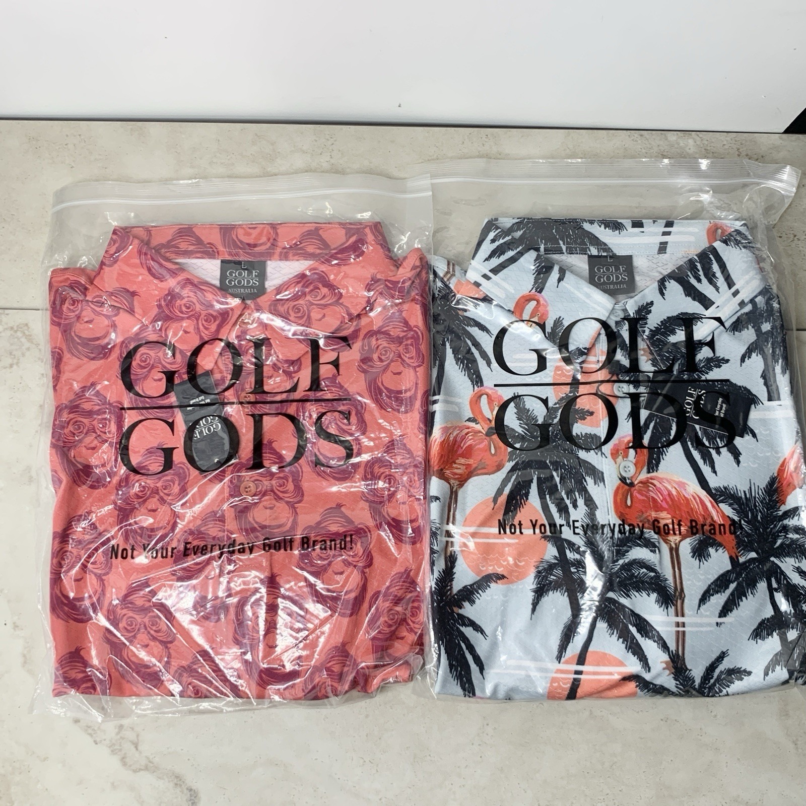 Golf Gods Australia Men Size Large Polo Shirt Lot 2 Tops Pink Monkey Blue Print
